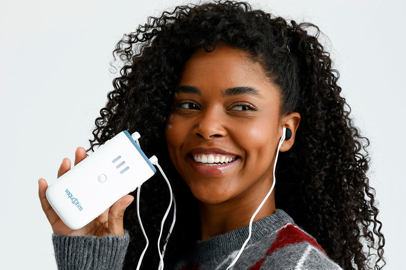 Person using vagus nerve stimulator for relaxation and calm mind